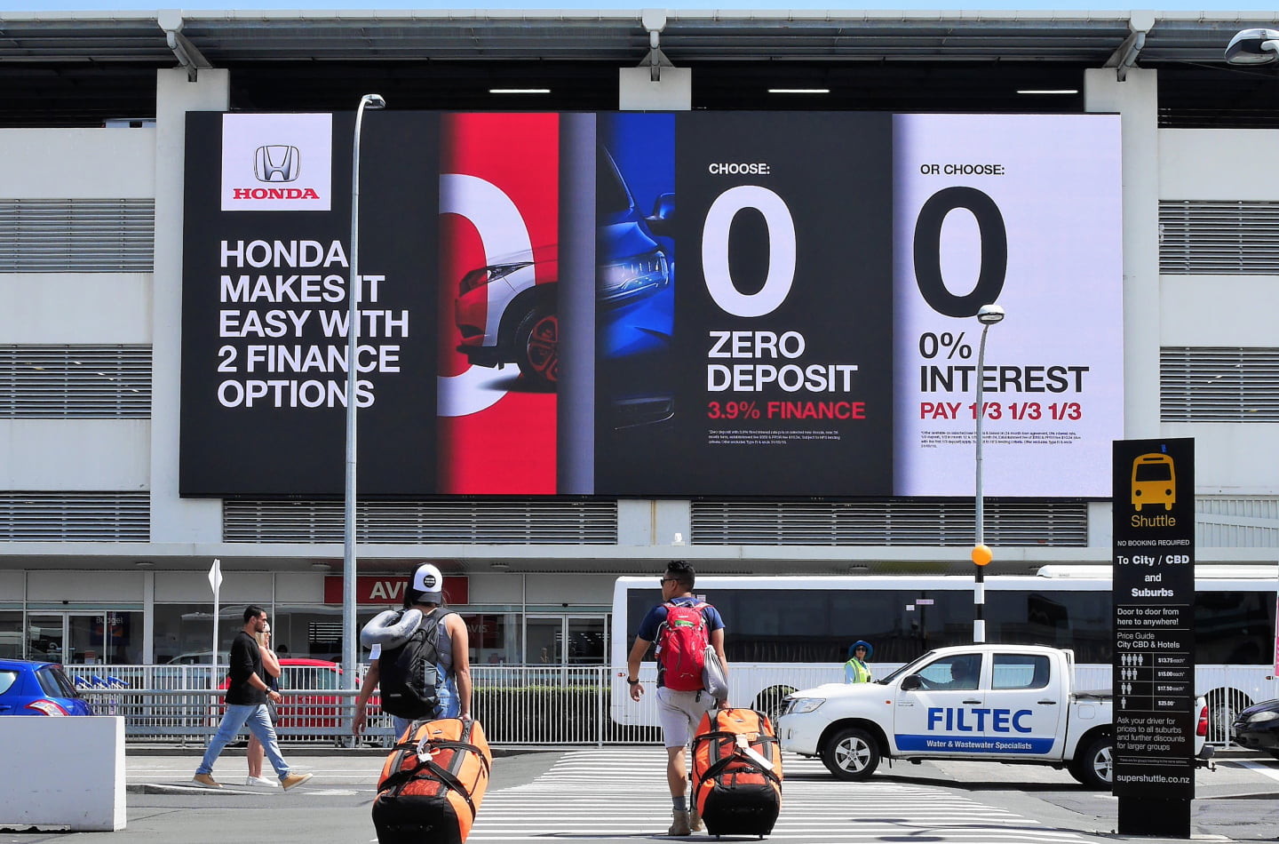 big tv adverts on airport building