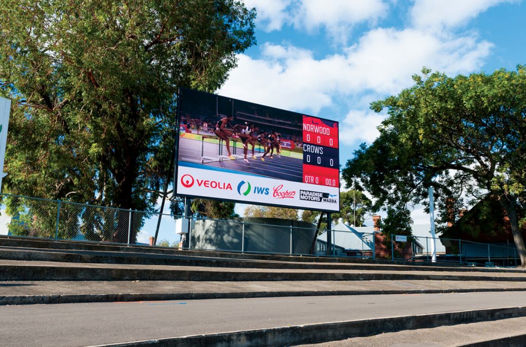 large sporting billboard at a running track