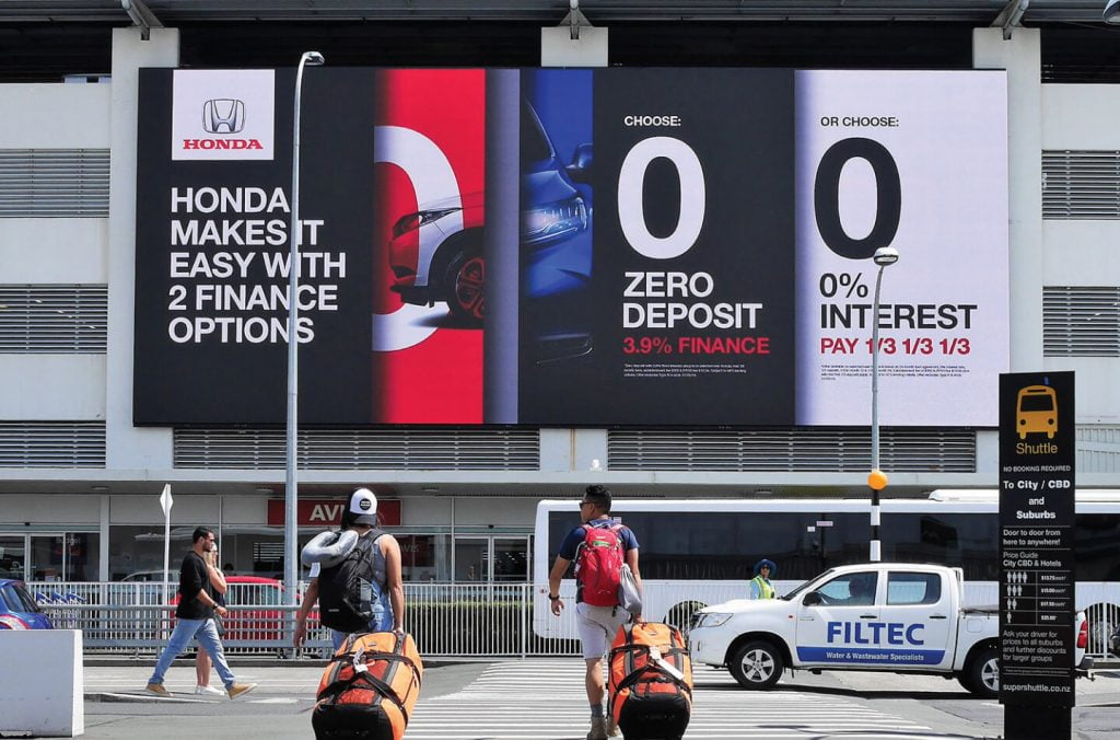 big digital advertisement billboard on airport building